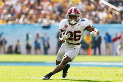 Alabama running back Jam Miller carries the ball.