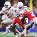 Arch Manning runs the ball.