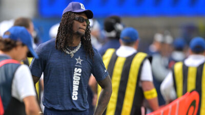 CeeDee Lamb in street clothes during an NFL preseason game.