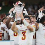 Rocco Becht and other Iowa State players celebrate after beating Kansas State in Dublin.