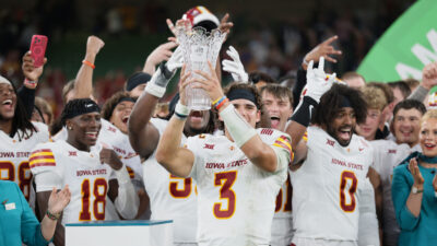 Rocco Becht and other Iowa State players celebrate after beating Kansas State in Dublin.