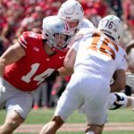 Arch Manning gets tackled.