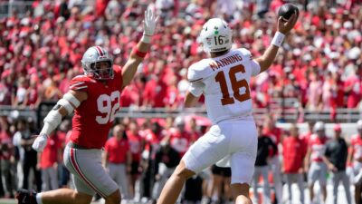 Arch Manning throws a pass against Ohio State.