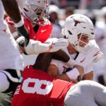 Arch Manning gets tackled.