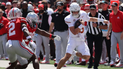 Texas quarterback Arch Manning runs the ball.