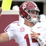 Ty Simpson warms up.