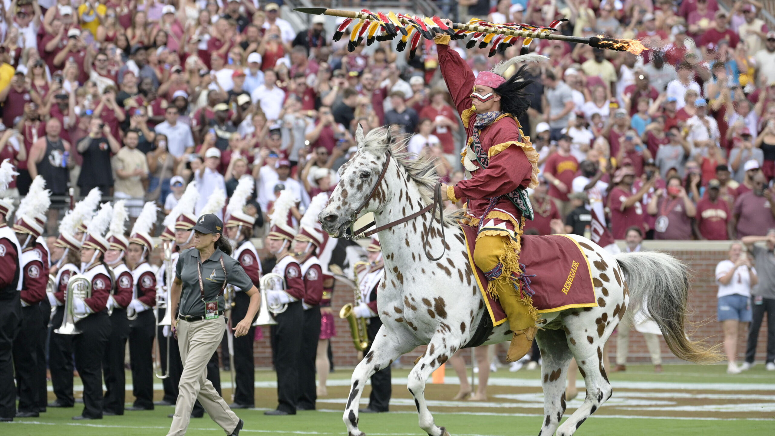 Florida State fans rush the field after upsetting Alabama