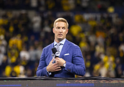 Joel Klatt sits at a game.