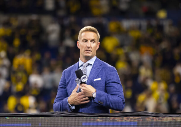 Joel Klatt sits at a game.