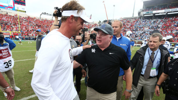 Ole Miss head coach Lane Kiffin with Kentucky head coach Mark Stoops.