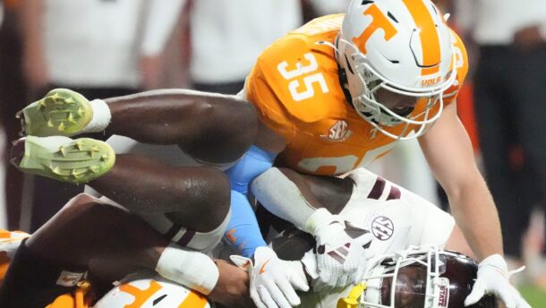 Tennessee player tackles a Mississippi State player.