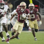 Micah Danzy runs through the Alabama defense.