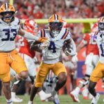 LSU linebacker West Weeks celebrates.