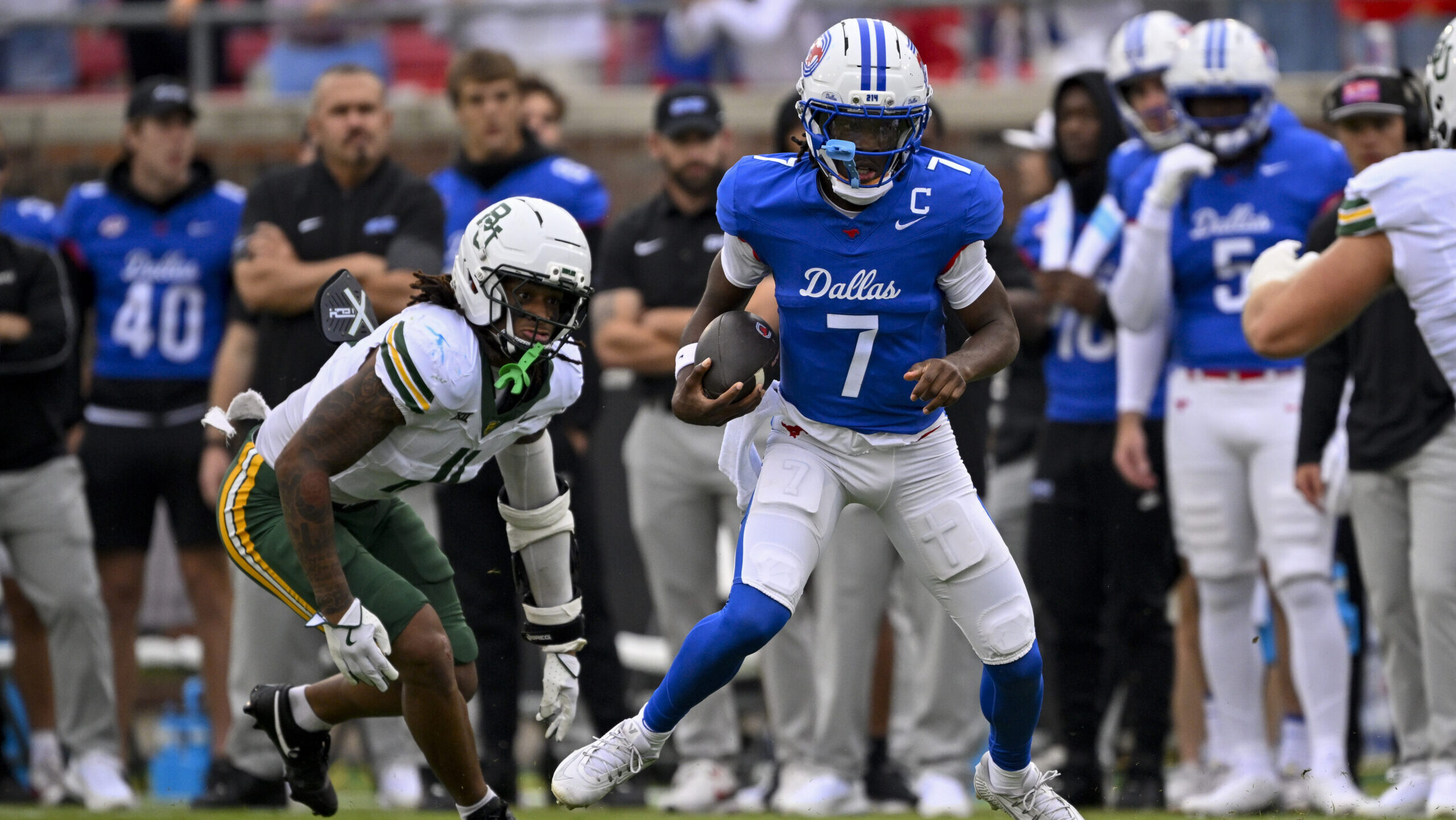 SMU quarterback clumsily brought down by referee for major loss