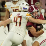 ULM punter Makenzie Ryan takes out Alabama's Cole Adams.