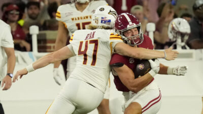 ULM punter Makenzie Ryan takes out Alabama's Cole Adams.