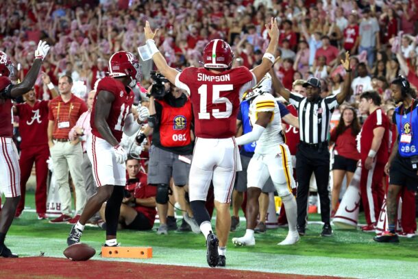 Alabama QB Ty Simpson celebrates a touchdown.