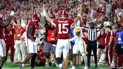Alabama QB Ty Simpson celebrates a touchdown.