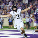 Army football player celebrates.