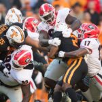 Tennessee and Georgia players play football.