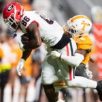 Georgia wide receiver Dillon Bell gets tackled by a Tennessee player.