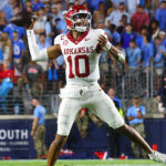 Arkansas QB Taylen Green throws a pass.