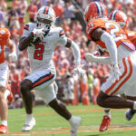 Syracuse player runs the ball vs. Clemson.