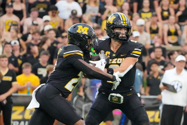 Mizzou QB Beau Pribula hands off to Ahmad Hardy.
