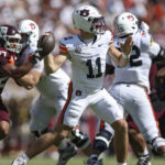 Jackson Arnold throws a pass.