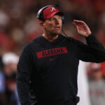 Kalen DeBoer coaches on the sidelines.