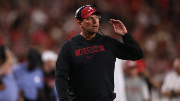 Kalen DeBoer coaches on the sidelines.