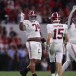 Alabama players celebrate a win at Georgia.