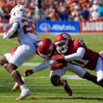 Texas and Oklahoma play football.