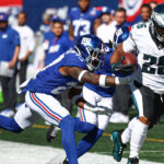 Saquon Barkley runs the ball against the Giants.