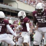 Texas A&M players celebrate a touchdown.