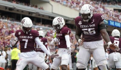 Texas A&M players celebrate a touchdown.