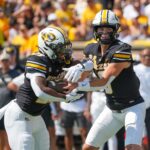 Beau Pribula hands the ball to Ahmad Hardy.