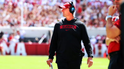 Kalen DeBoer coaches during a game.