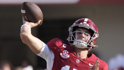 Ty Simpson throws a pass.