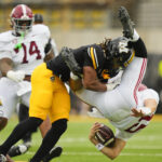 Ty Simpson takes a big hit.