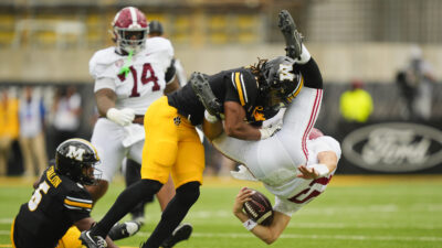 Ty Simpson takes a big hit.