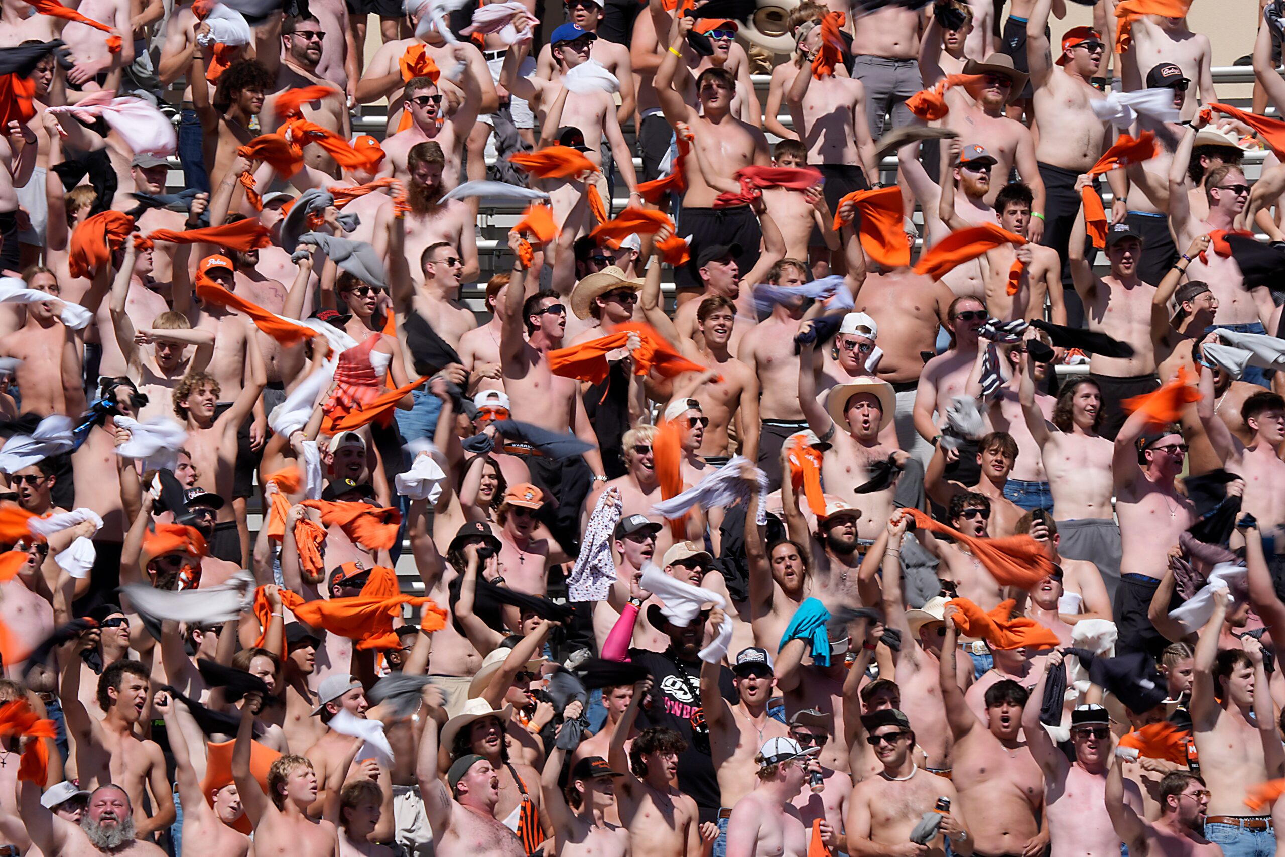 Oklahoma State fans cope with another brutal loss by going shirtless en masse