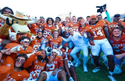 Texas players and coaches celebrate a rivalry win over Oklahoma.