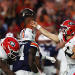 Georgia quarterback Gunner Stockton throws a pass.