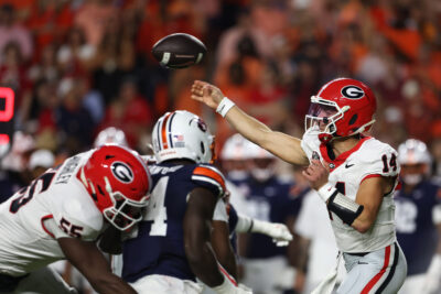 Georgia quarterback Gunner Stockton throws a pass.