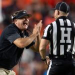 Georgia coach Kirby Smart talks to an official.