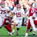 Ty Simpson runs the ball.