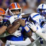 Florida and Kentucky play football.