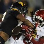 Oklahoma and Missouri play football.