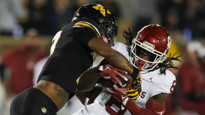 Oklahoma and Missouri play football.